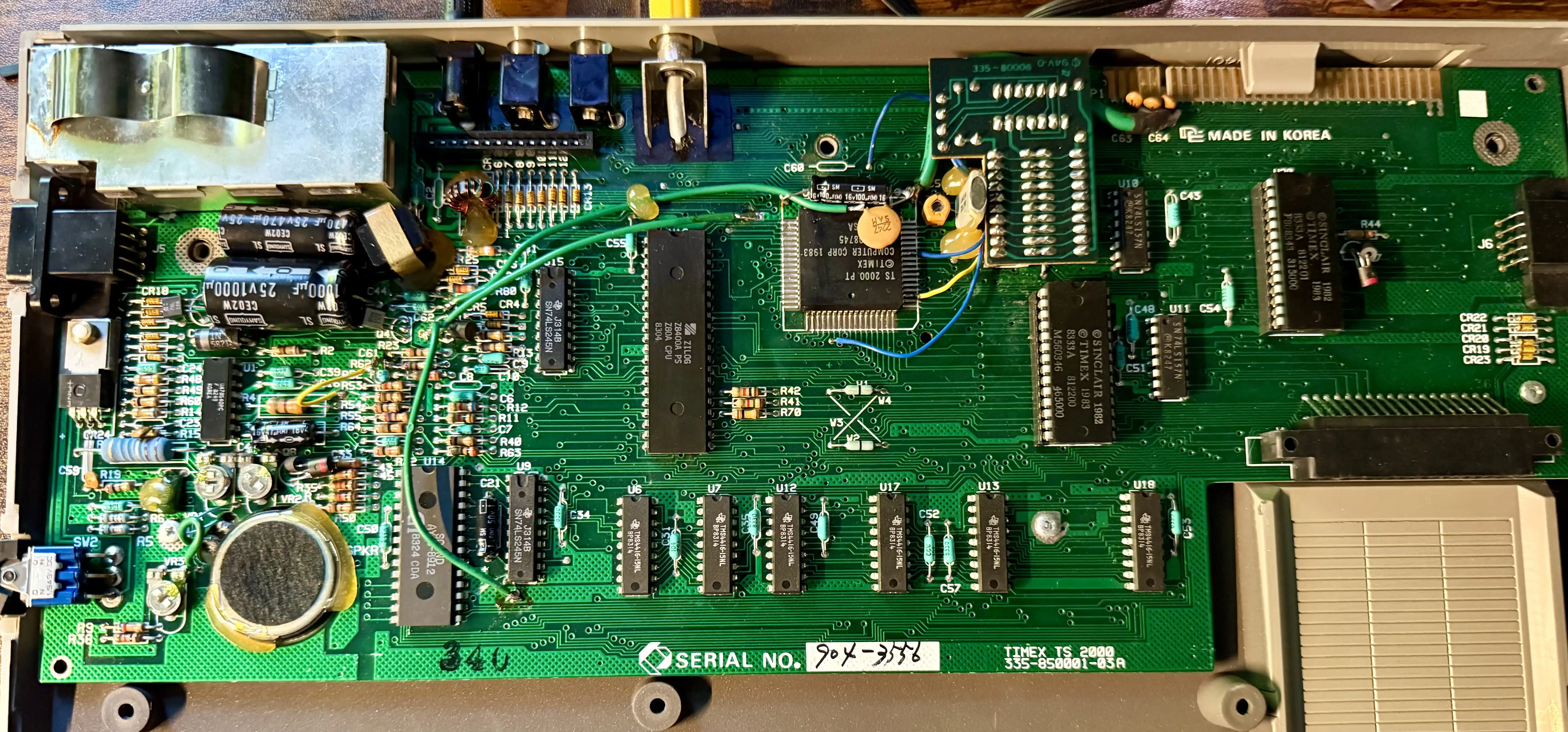 Inside the 2068. Z80A in the center, the big black square to the right is the Timex SCLD video chip (TS 2000), the ROM is over on the right edge. The board reads MADE IN KOREA along the right side.